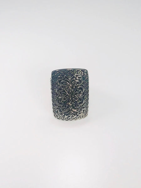 Rectangular sterling silver ring with floral and scrollwork filigree, showcasing vintage-inspired elegance and fine craftsmanship.